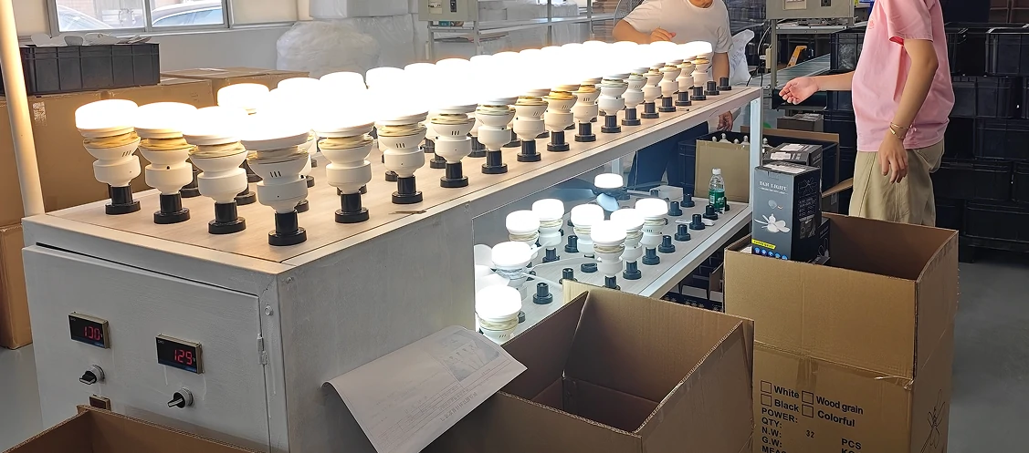 Product development and testing process for living room ceiling fan showing LED performance validation and quality checks in modern industrial workshop.