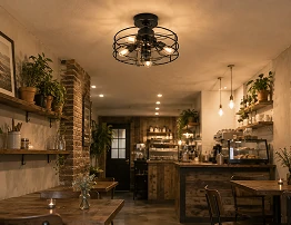 14 inch black cage hugger ceiling fan with E27 lights installed in a boutique café and small retail environment