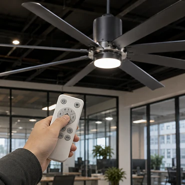Remote control operation of a 70 inch industrial large ceiling fan with LED light in a commercial workspace