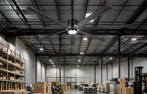 70 inch industrial large ceiling fan with LED light providing efficient airflow in a commercial warehouse