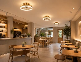 Oscillating air multiplier ceiling fan light installed in a modern restaurant dining area