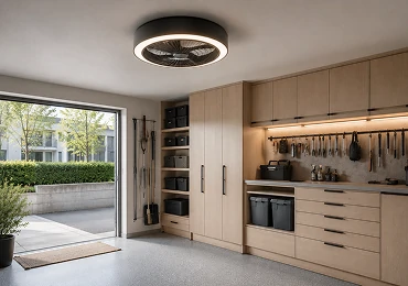 Flush mount ceiling fan installed in low ceiling residential garage or utility space with integrated LED lighting