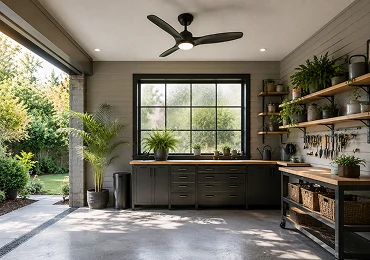 Smart ceiling fan installed in residential utility space with remote control and energy-saving LED lighting