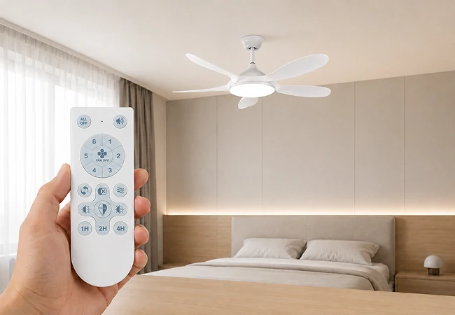 hand holding remote control operating small ceiling fan with LED light installed in modern kids bedroom showing smart dc motor functionality and adjustable speed settings for OEM projects