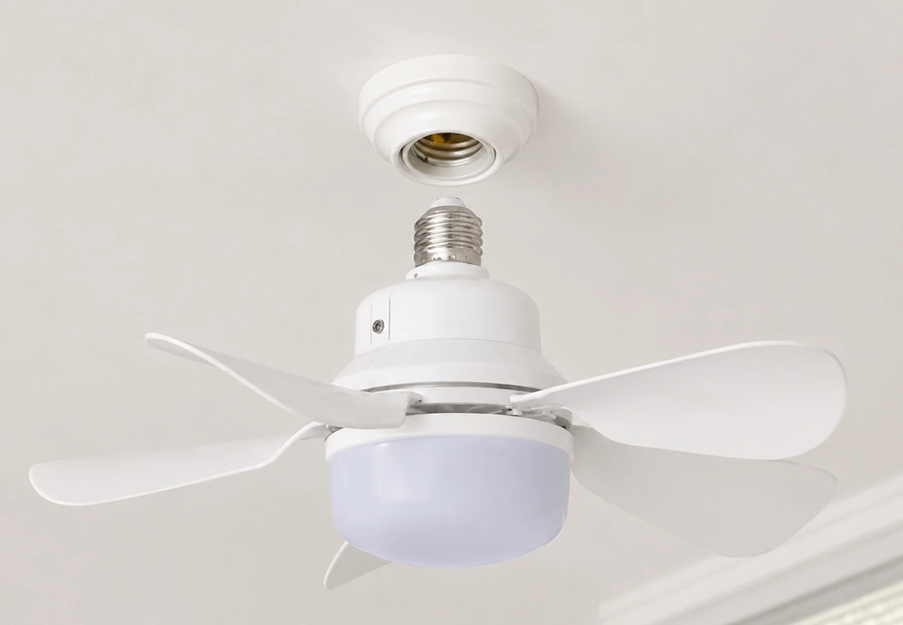 Compact ceiling fan that plugs into light socket for easy installation